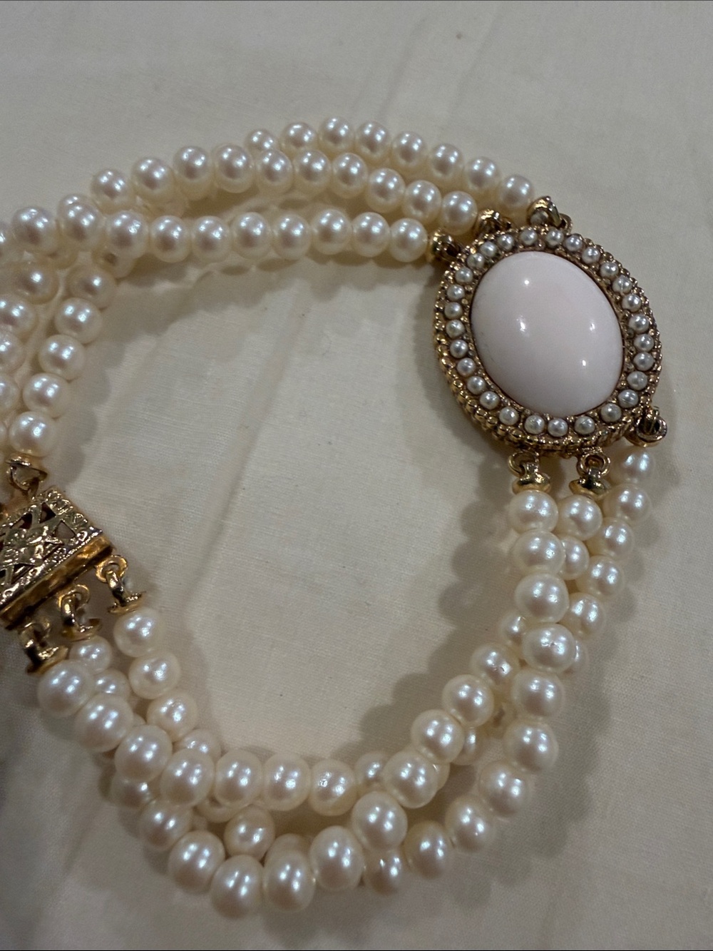 Cream Pearl Triple-Strand Bracelet with Gold Cameo Accent